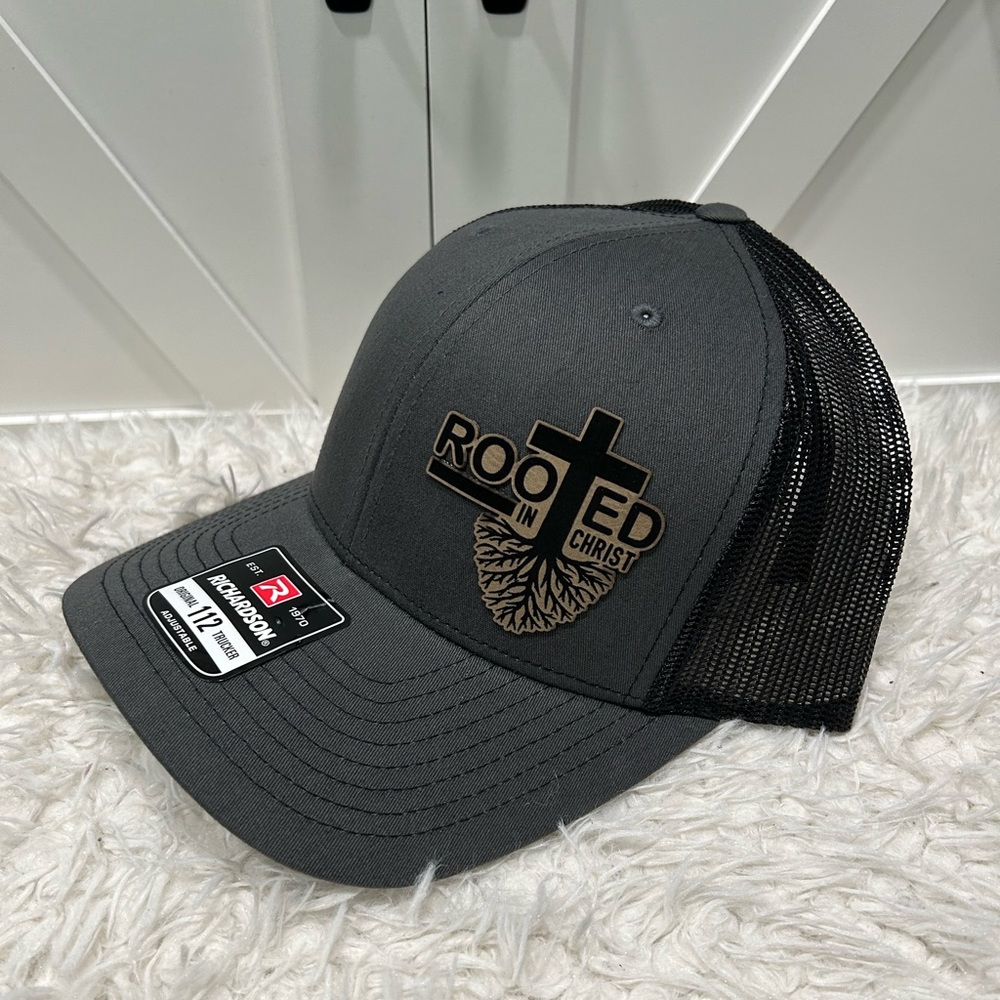 Laser engraved. Rooted in Christ, Richardson 112 trucker hat.